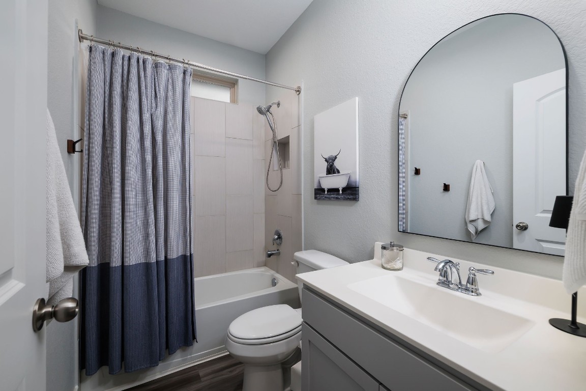 1507 Oakdale Crest Road Montgomery, TX 77316 - Photo 11 of 23 a bathroom with a sink toilet double vanity and shower