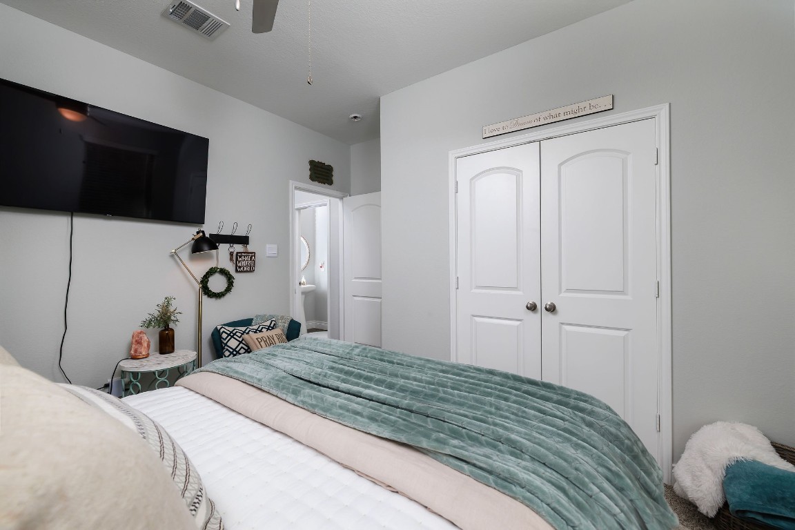 1507 Oakdale Crest Road Montgomery, TX 77316 - Photo 13 of 23 a bedroom with a bed and a flat screen tv