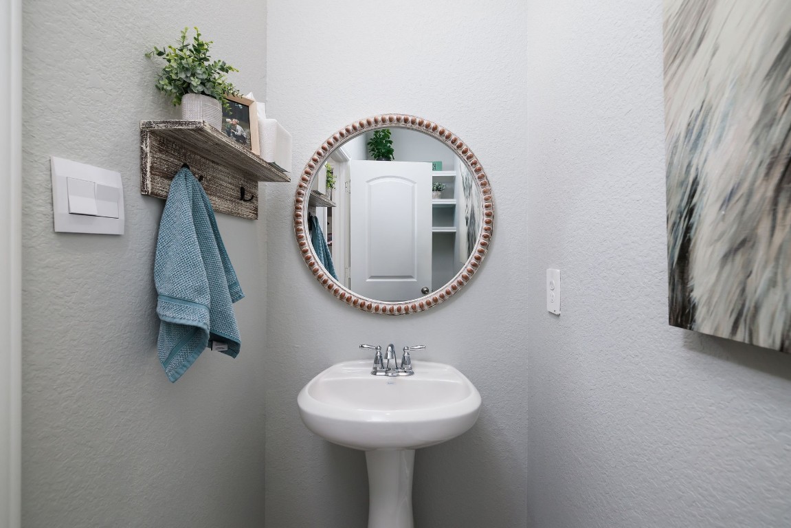 1507 Oakdale Crest Road Montgomery, TX 77316 - Photo 14 of 23 a bathroom with a sink and a mirror