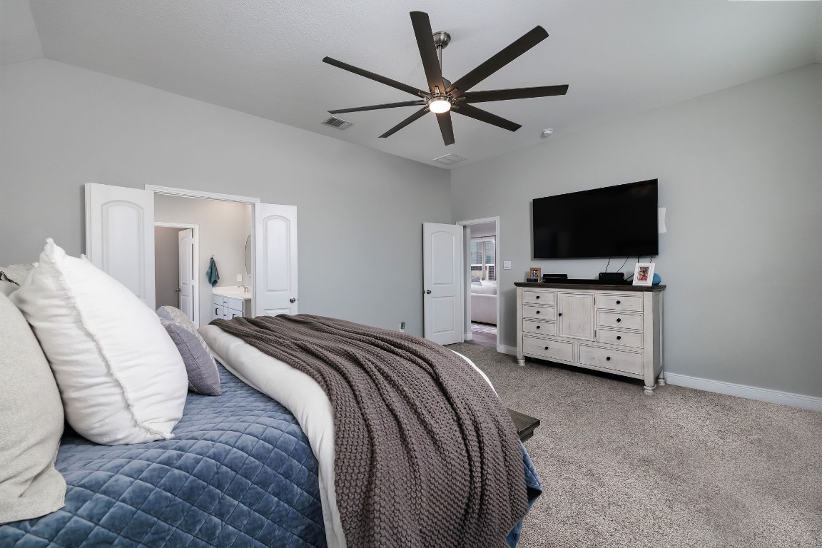 1507 Oakdale Crest Road Montgomery, TX 77316 - Photo 16 of 23 a view of a bedroom with bed and tv