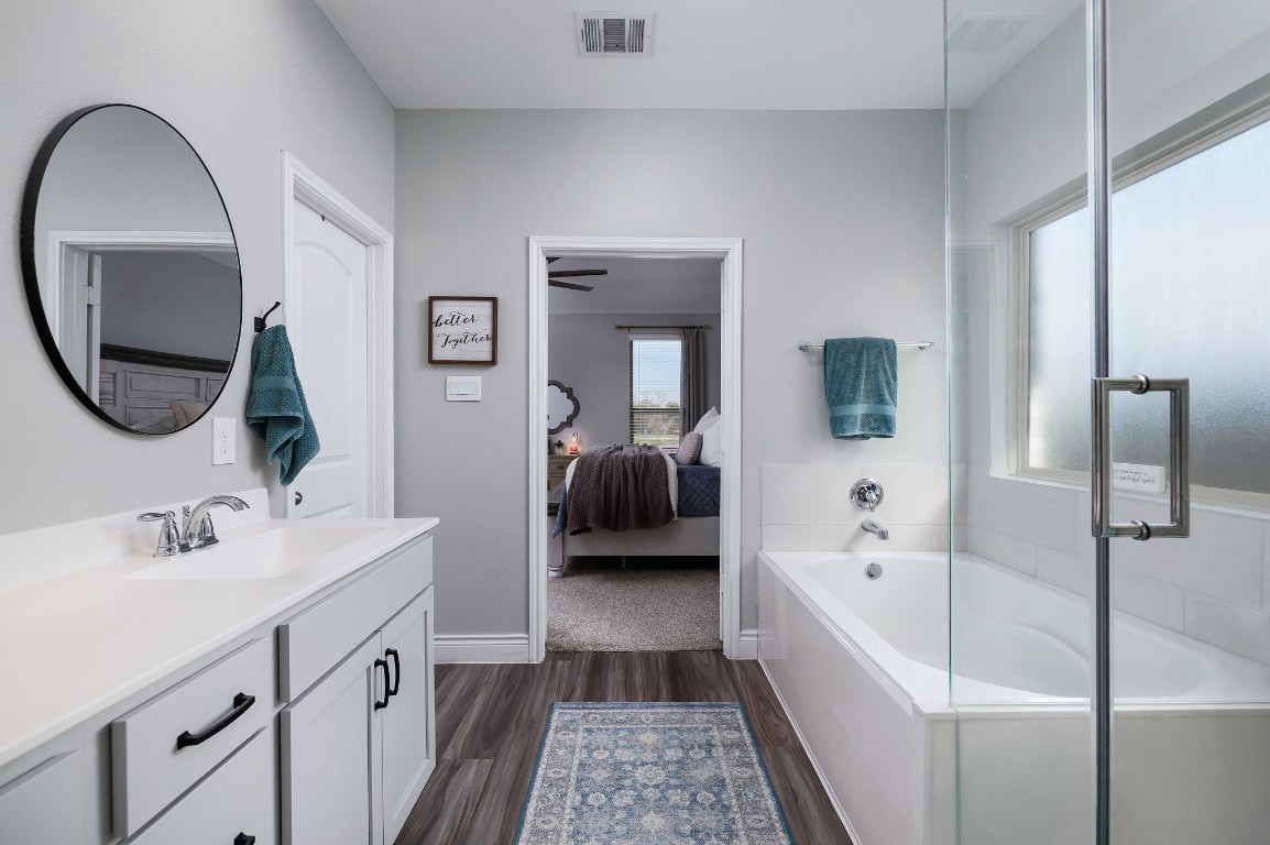 1507 Oakdale Crest Road Montgomery, TX 77316 - Photo 18 of 23 a en suite spacious bathroom with a double vanity sink and a mirror