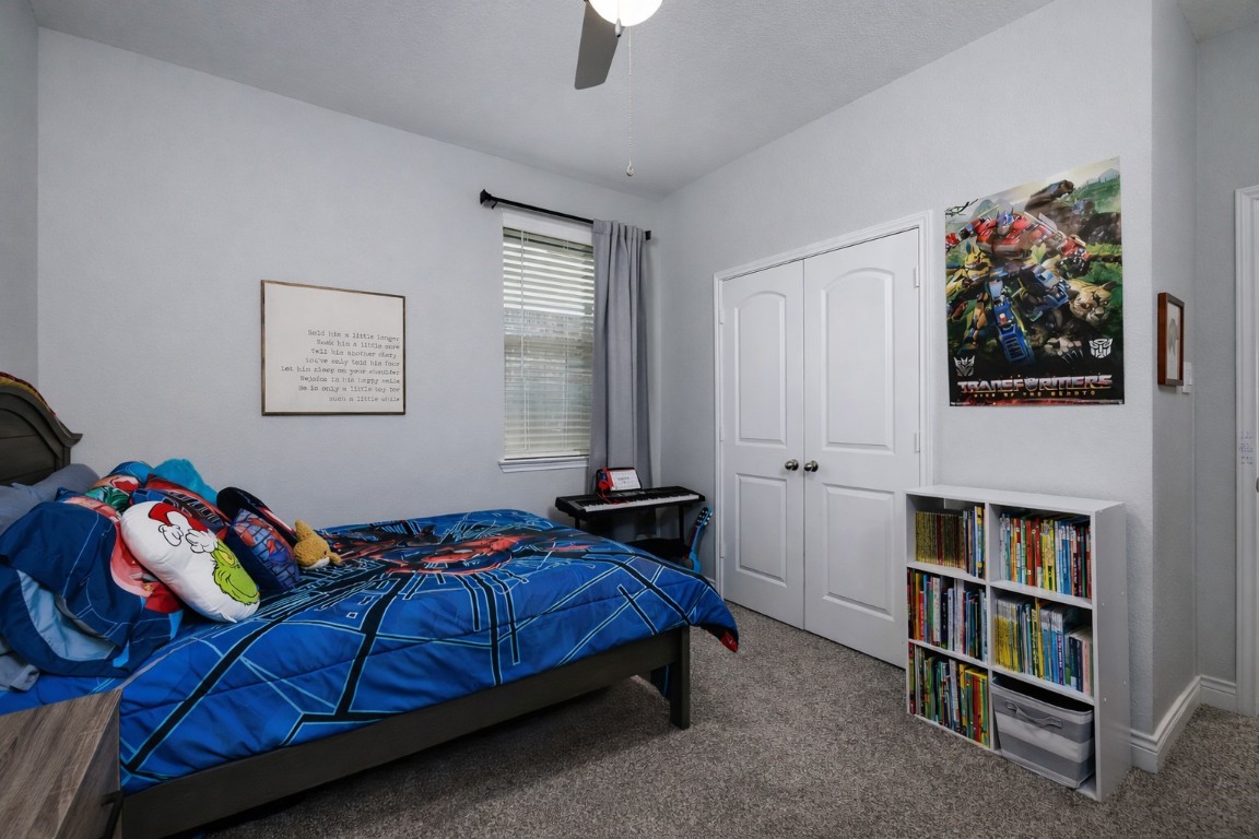 1507 Oakdale Crest Road Montgomery, TX 77316 - Photo 20 of 23 a bedroom with a bed and a book shelf