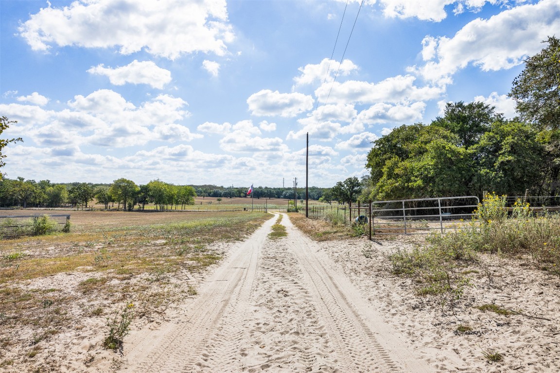 2025-2135 Mule Creek Road Harwood, TX 78632 - Photo 9 of 28 a view of a lake with a yard