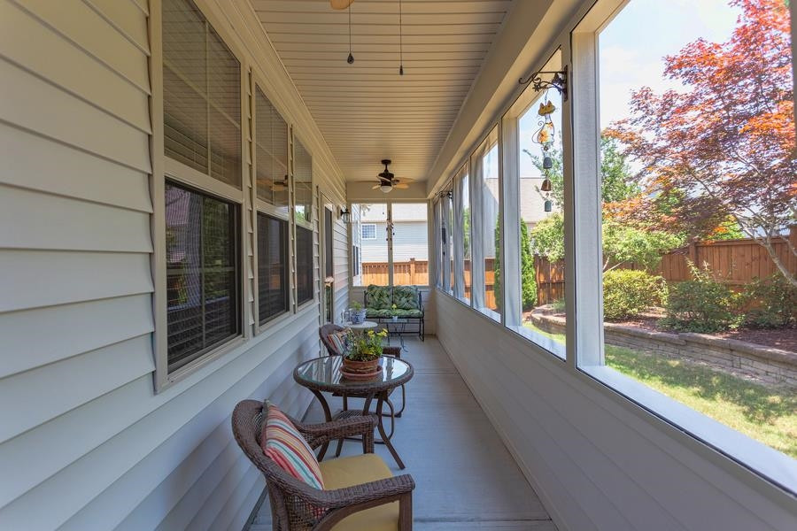 8612 Lasilla Way Raleigh, NC 27616 - Photo 19 of 27 The screened back porch just off the living room, has a front row seat to the lovingly landscaped backyard. Screened Porch