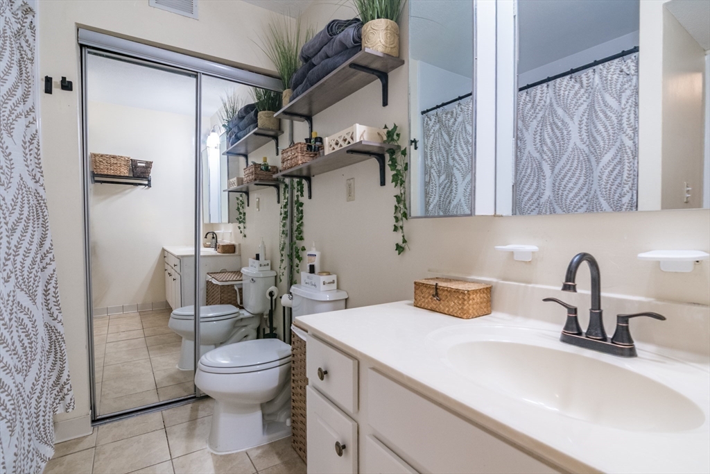 244 Nassau Drive, Unit 244 Springfield, MA 01129 - Photo 15 of 17 a bathroom with a toilet sink and shower