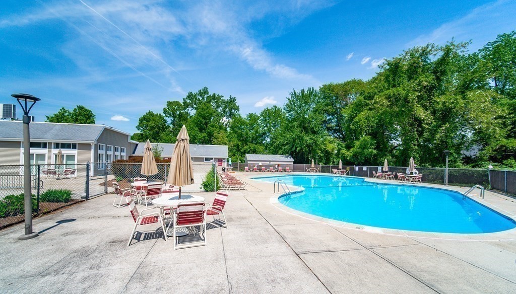 244 Nassau Drive, Unit 244 Springfield, MA 01129 - Photo 17 of 17 an outdoor space with swimming pool and furniture