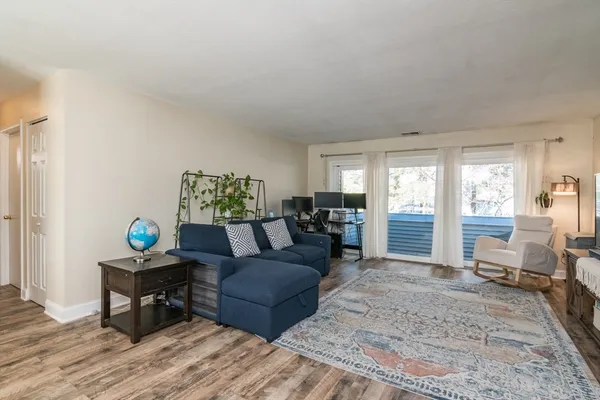 a living room with furniture and a table