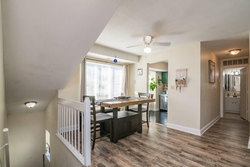 244 Nassau Drive, Unit 244 Springfield, MA 01129 - Photo 6 of 17 a view of a kitchen with a stove wooden floor and a kitchen