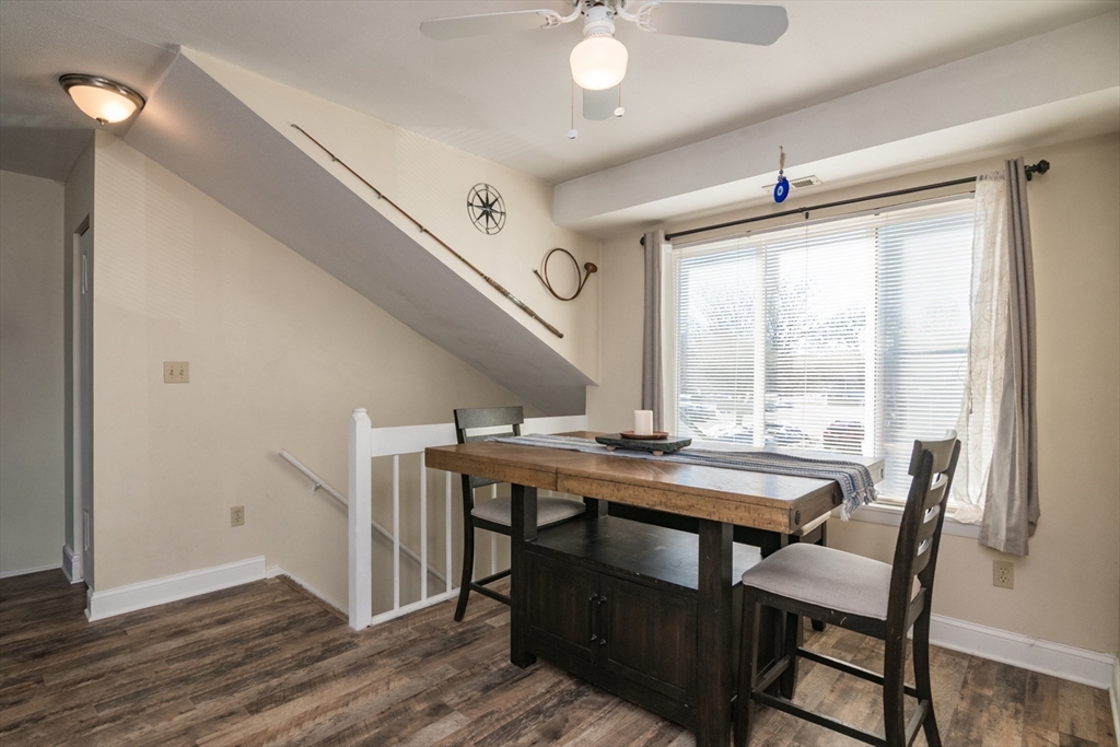 244 Nassau Drive, Unit 244 Springfield, MA 01129 - Photo 7 of 17 a view of a dining room with furniture window and wooden floor