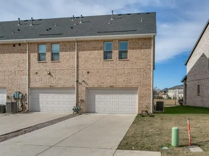 a front view of a house with a garage