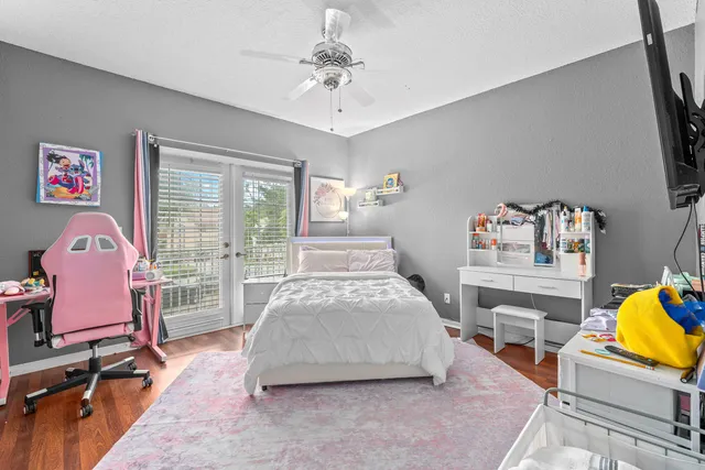 a bed room with a bed and a chair