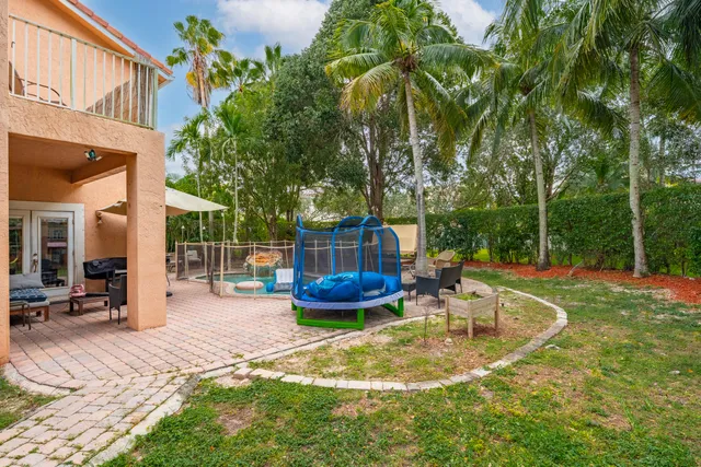 a view of a swimming pool with a patio