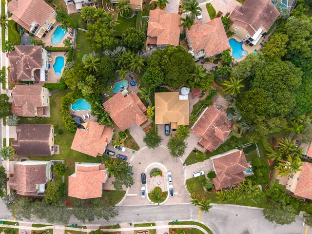 an aerial view of residential house with outdoor space and swimming pool