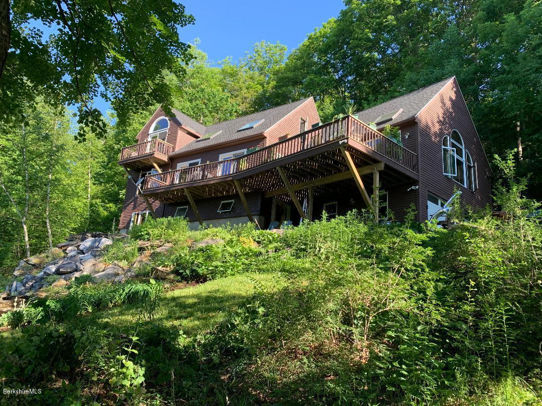 7 Noppet Road Lanesborough, MA 01237 - Photo 2 of 42 a view of a house with a small yard plants and large tree