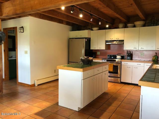 7 Noppet Road Lanesborough, MA 01237 - Photo 11 of 42 a kitchen with a sink appliances and cabinets