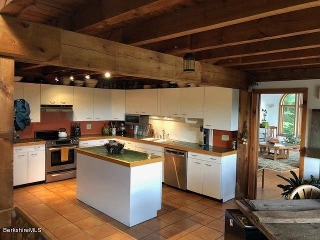 7 Noppet Road Lanesborough, MA 01237 - Photo 13 of 42 a kitchen with stainless steel appliances granite countertop a sink a stove and a refrigerator