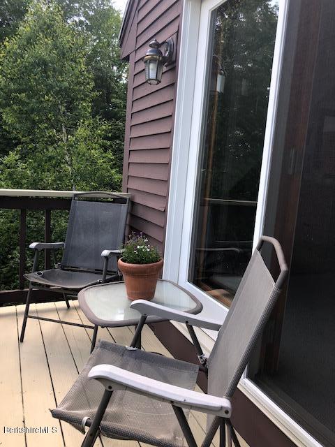 7 Noppet Road Lanesborough, MA 01237 - Photo 22 of 42 a view of backyard with outdoor seating and plants