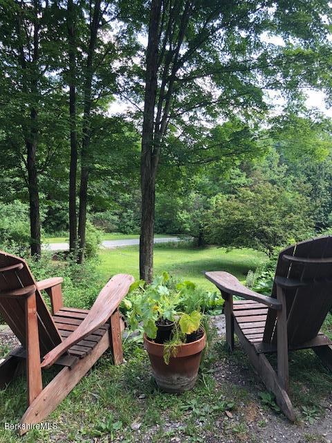 7 Noppet Road Lanesborough, MA 01237 - Photo 33 of 42 a view of a deck with a chair and wooden fence