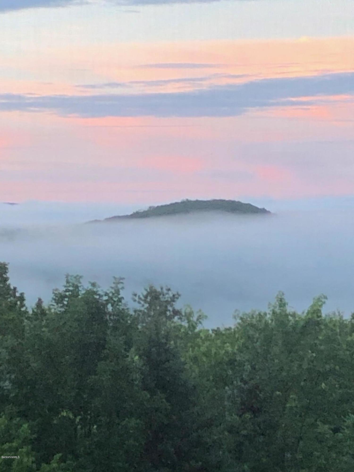 7 Noppet Road Lanesborough, MA 01237 - Photo 39 of 42 a view of a lake in middle of forest