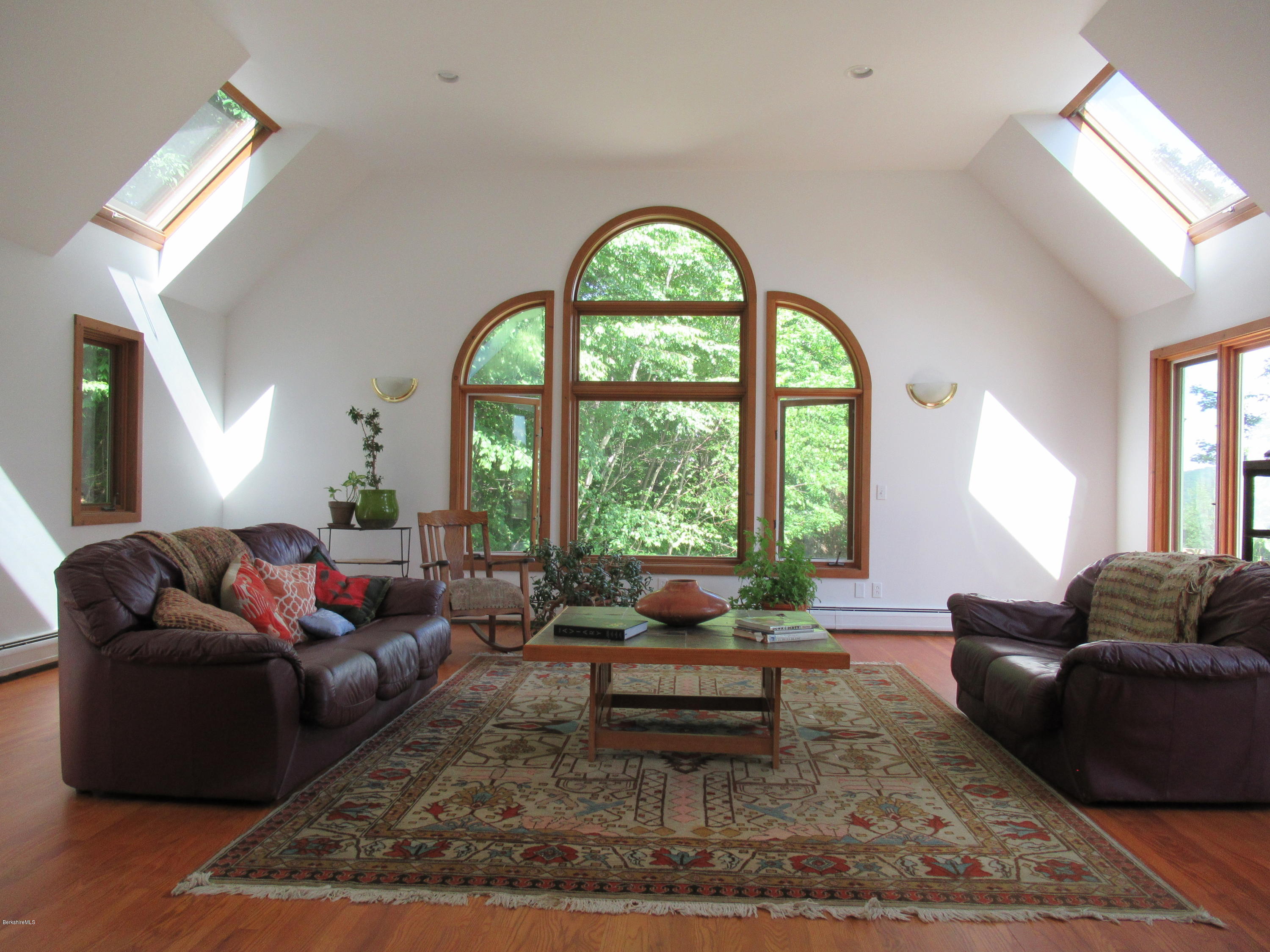 7 Noppet Road Lanesborough, MA 01237 - Photo 9 of 42 a living room with furniture and a large window