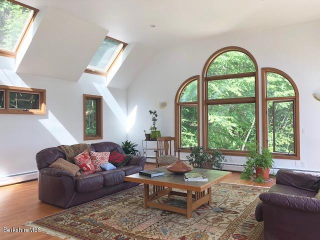 7 Noppet Road Lanesborough, MA 01237 - Photo 10 of 42 a living room with furniture and a large window