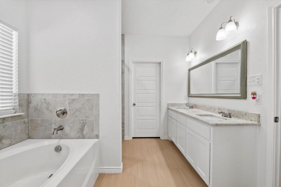 298 Greanead Road Forestburg, TX 76239 - Photo 24 of 38 a bathroom with a tub sink and mirror
