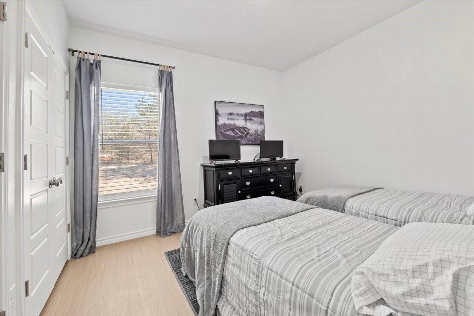 298 Greanead Road Forestburg, TX 76239 - Photo 29 of 38 a bedroom with a bed and a window