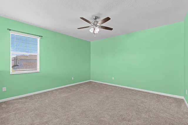 a view of a big room with windows