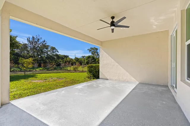 a view of a big room with a big yard and potted plants