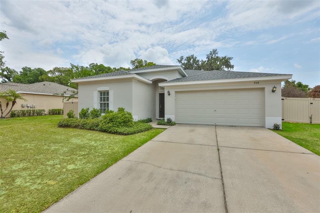708 Coade Stone Drive Seffner, FL 33584 - Photo 41 of 48 a view of garage and yard