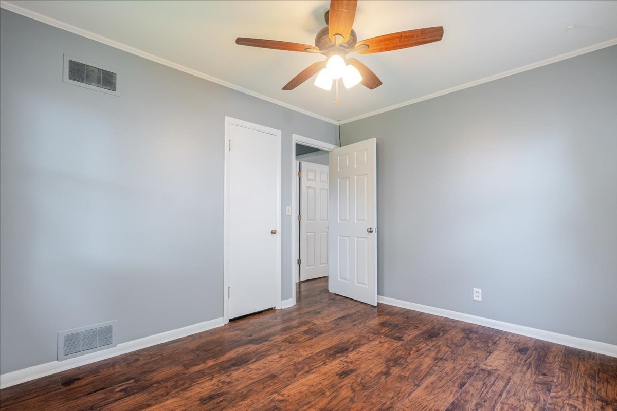 307 Meadows Avenue Bloomington, IL 61701 - Photo 12 of 15 a view of an empty room with wooden floor