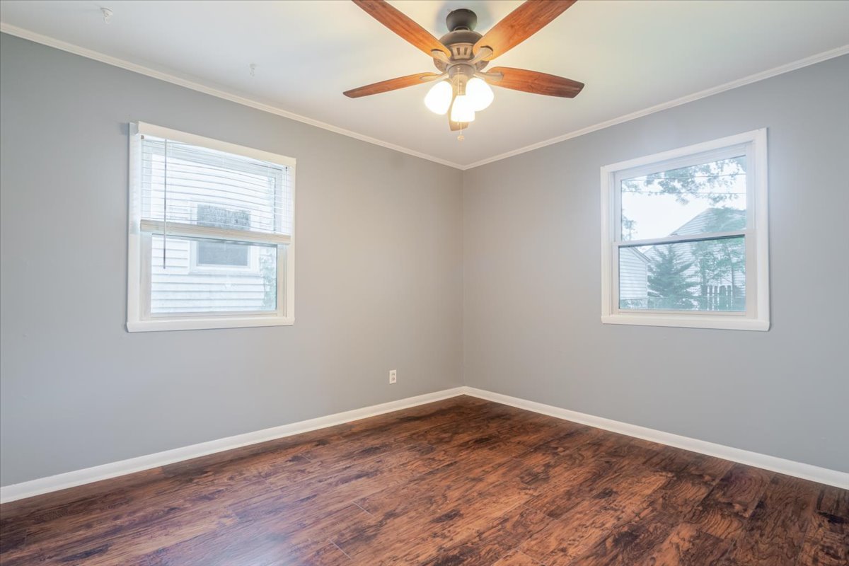 307 Meadows Avenue Bloomington, IL 61701 - Photo 13 of 15 a view of empty room with wooden floor and fan