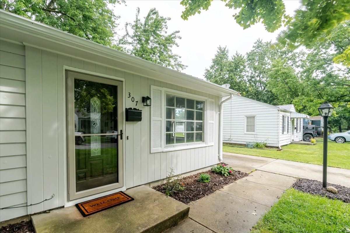 307 Meadows Avenue Bloomington, IL 61701 - Photo 2 of 15 a view of a backyard with a garden and plants