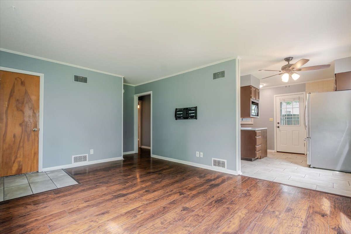 307 Meadows Avenue Bloomington, IL 61701 - Photo 4 of 15 a view of a livingroom with wooden floor