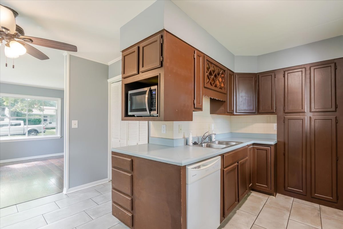 307 Meadows Avenue Bloomington, IL 61701 - Photo 6 of 15 a kitchen with stainless steel appliances granite countertop a sink and a refrigerator