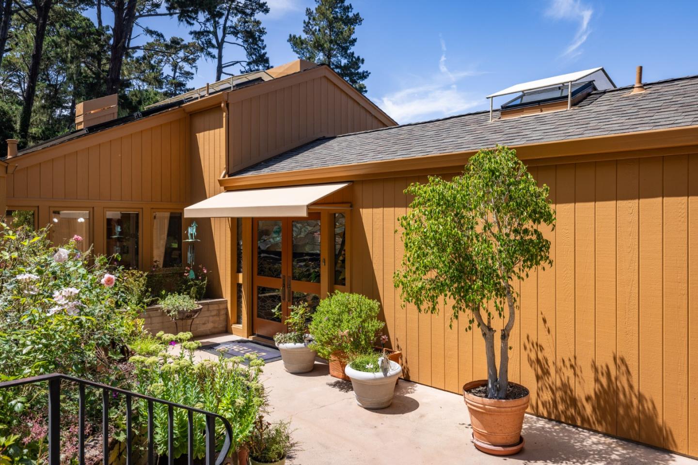 540 Aguajito Road Carmel, CA 93923 - Photo 6 of 32 a view of a house with potted plants