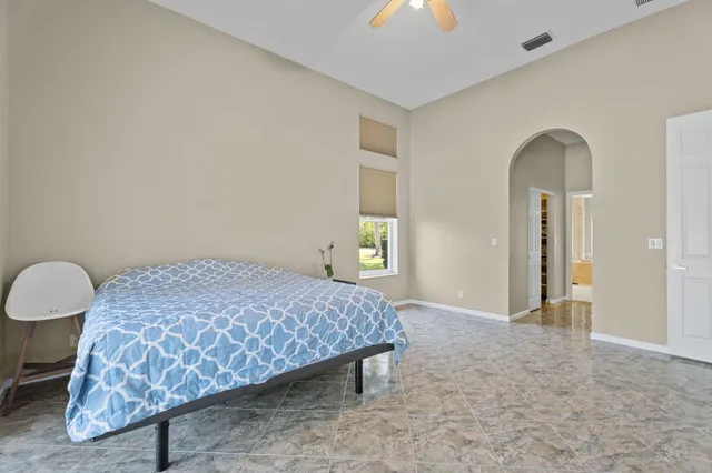a view of a hallway with wooden floor and closet
