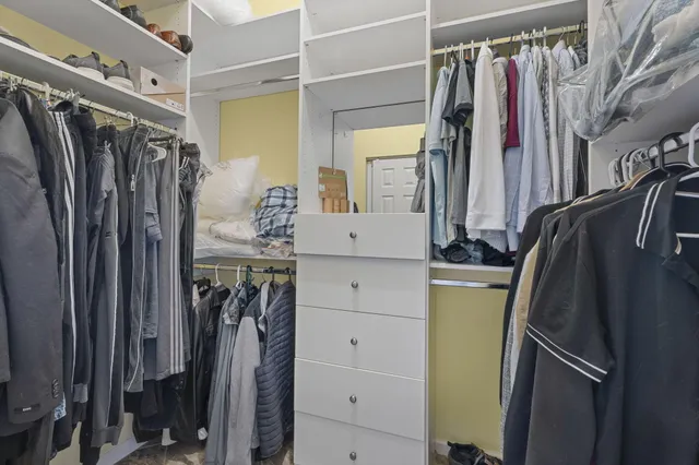 a spacious bathroom with a tub sink shower and mirror