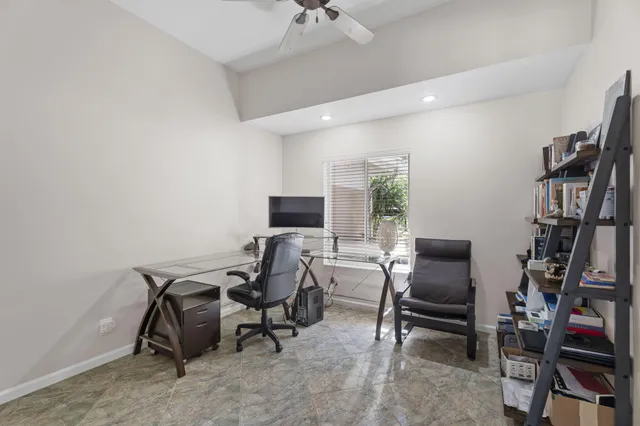 a view of a workspace with furniture