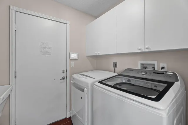 a view of a house with swimming pool and porch