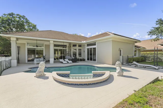 a view of a swimming pool with a lounge chairs