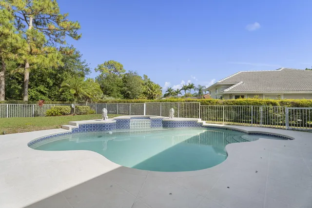 a lobby with furniture and large windows