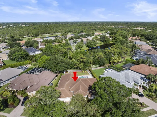 an aerial view of residential building and lake
