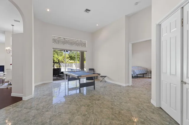 a view of an entryway with wooden floor