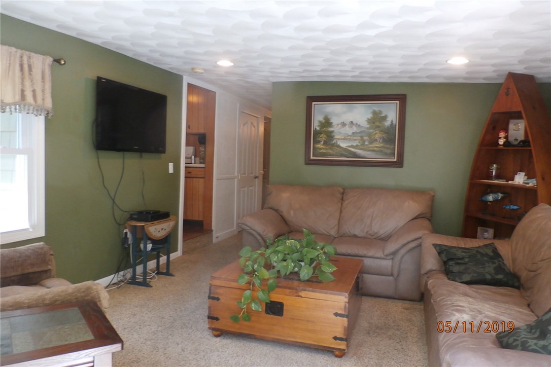 108 Lakeland Road Cranston, RI 02910 - Photo 12 of 31 SUNROOM GOING INTO THE HOUSE