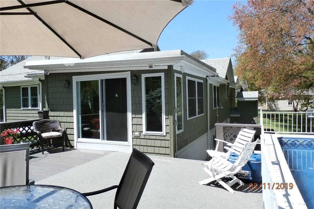 108 Lakeland Road Cranston, RI 02910 - Photo 10 of 31 DECK LEADS INTO THE SUNROOM