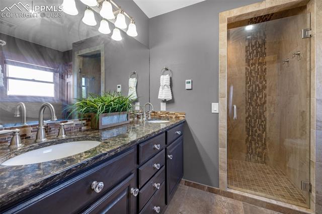 1270 Montezuma Road Colorado Springs, CO 80920 - Photo 18 of 42 Master bath with double vanity and spacious shower