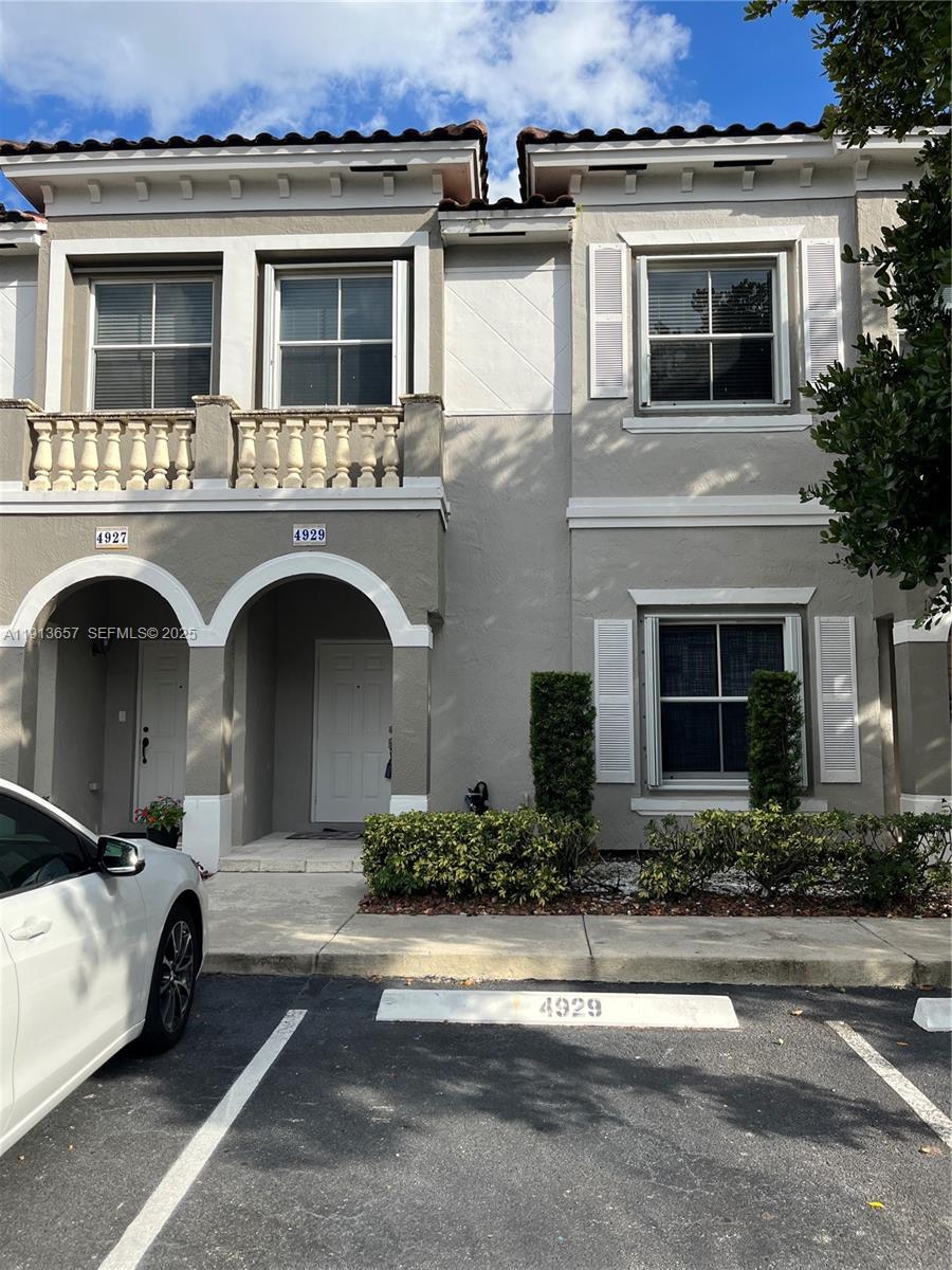 a front view of a house with yard