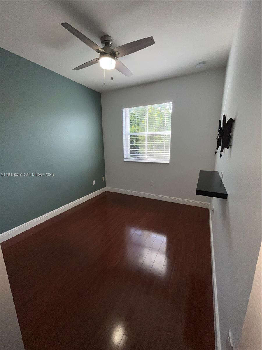 4929 Southwest 140th Terrace, Unit 5 Miramar, FL 33027 - Photo 24 of 43 an empty room with a window