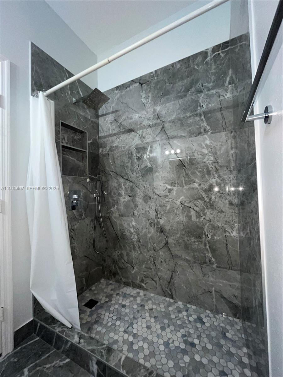 4929 Southwest 140th Terrace, Unit 5 Miramar, FL 33027 - Photo 27 of 43 a bathroom with a shower